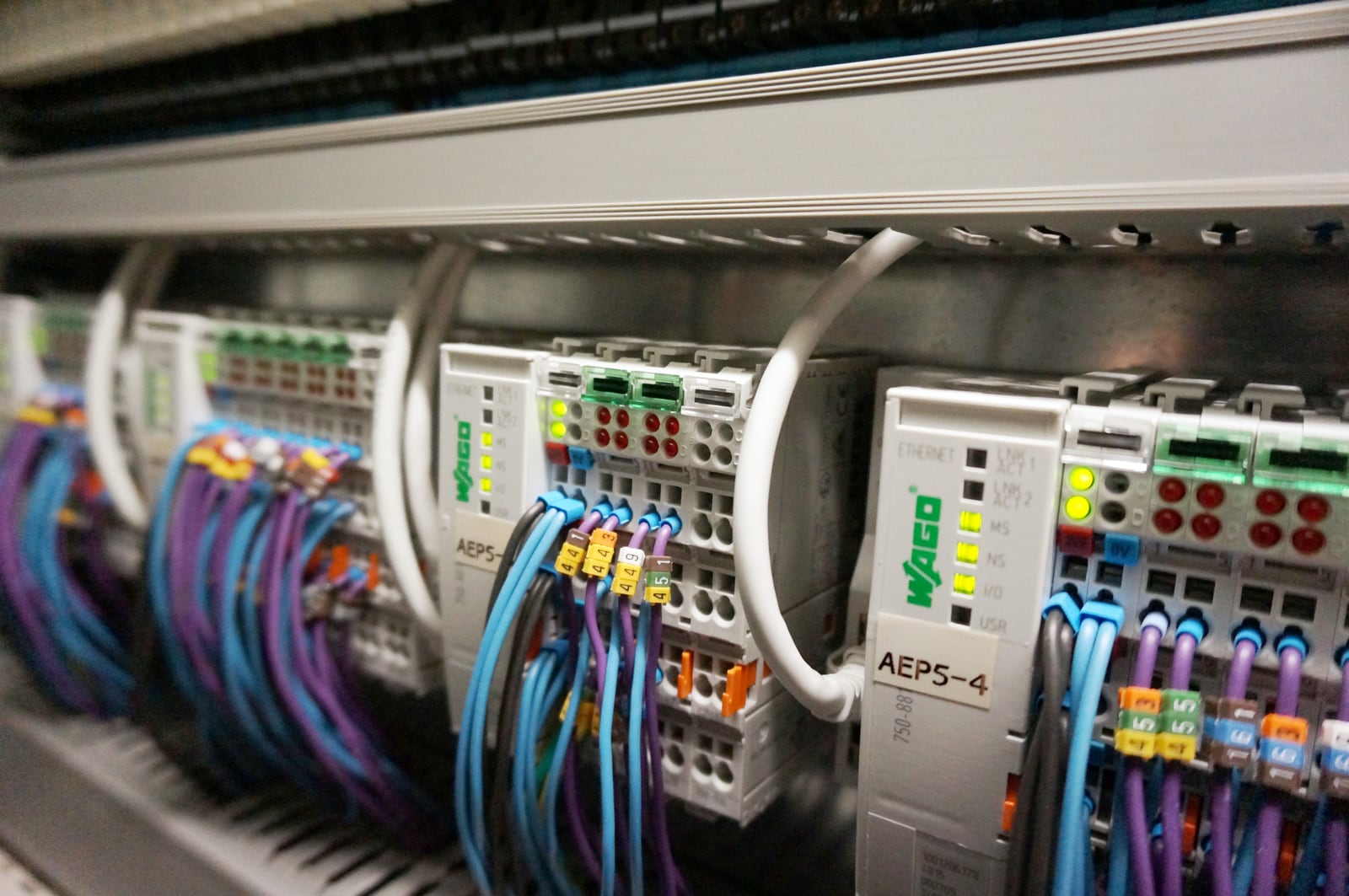 WAGO industrial controller with Ethernet connections, I/O modules and field wiring inside a control cabinet
