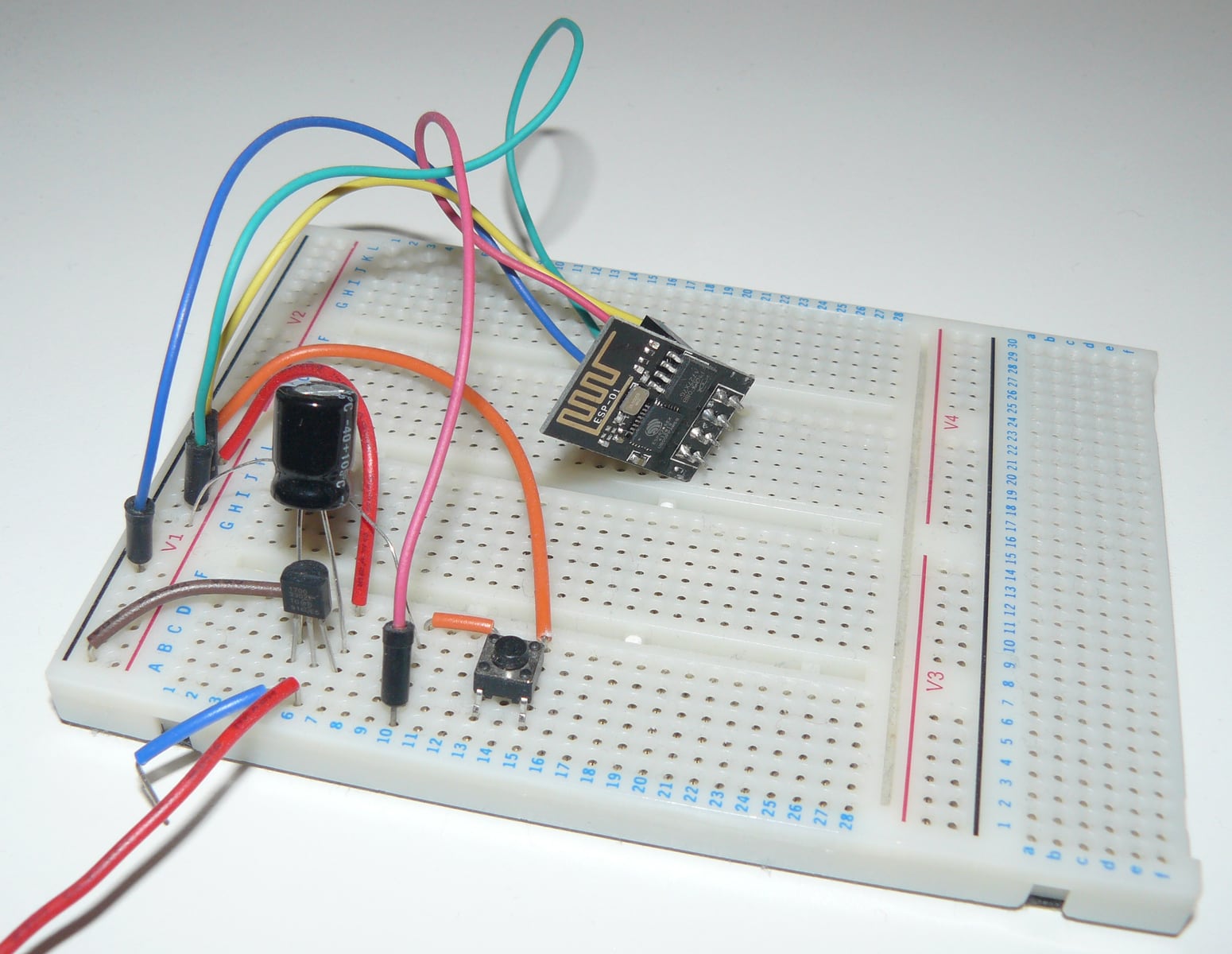 ESP-01 Wi-Fi module connected to components and jumper wires on a solderless breadboard