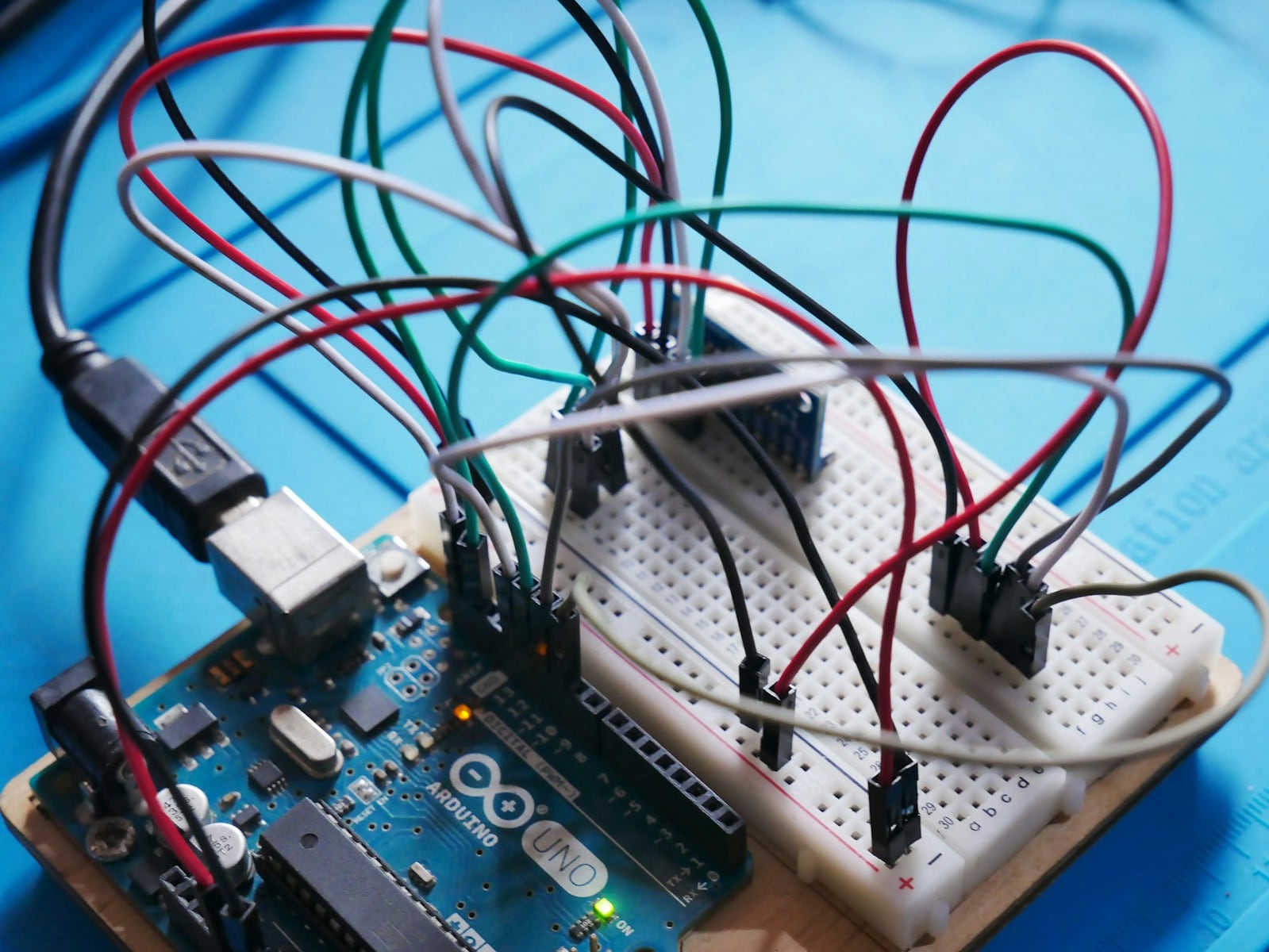 Arduino Uno development board wired to several sensors on breadboards