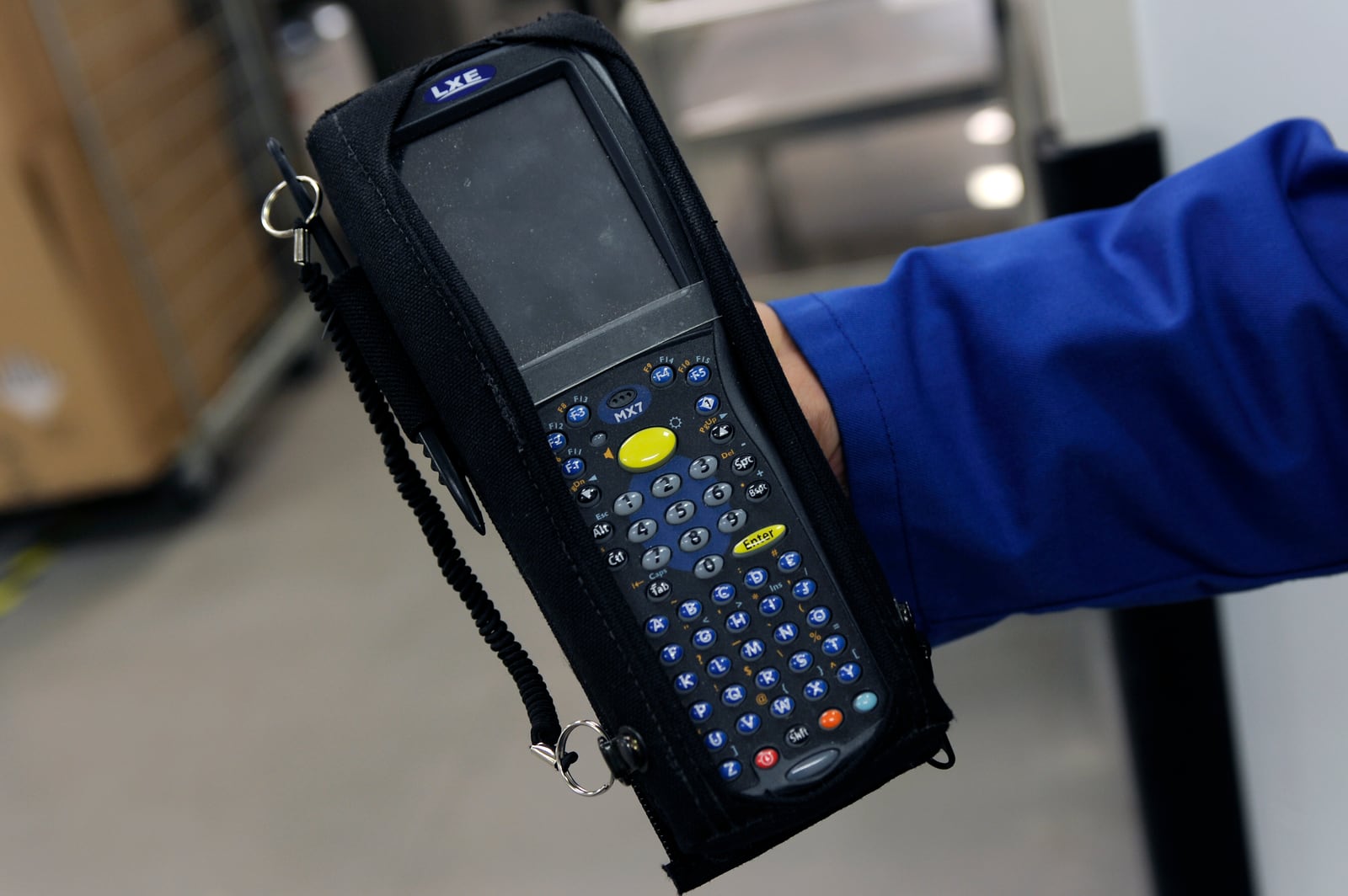 Handheld barcode terminal used to track packages in a logistics process