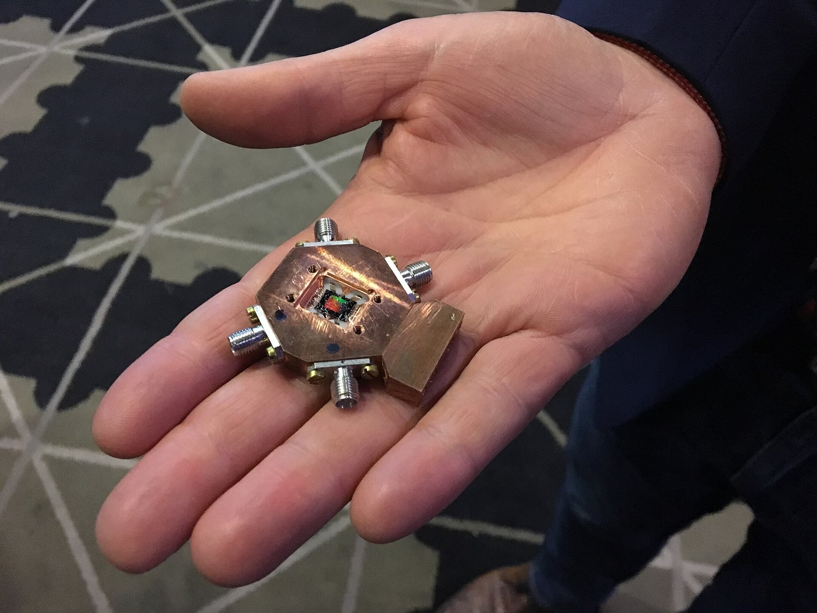 Three-qubit superconducting quantum processor held in a hand