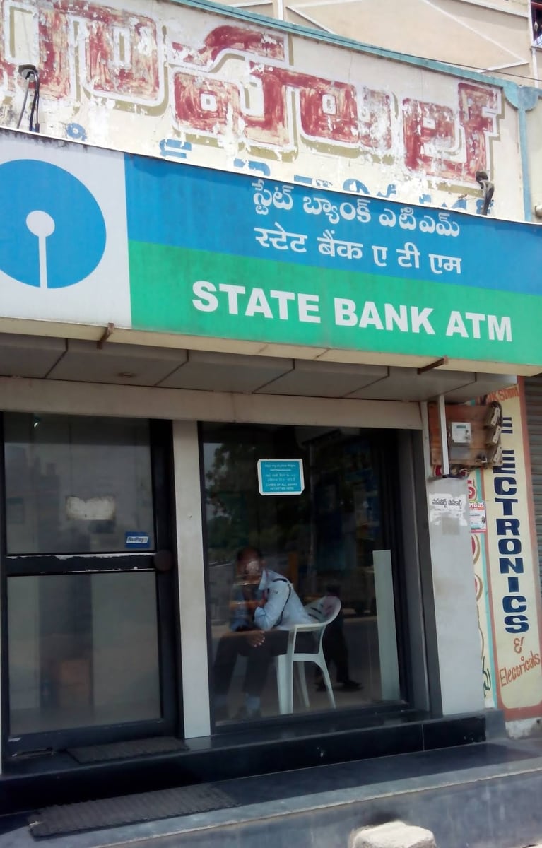 Freestanding bank ATM with card slot, keypad and customer display
