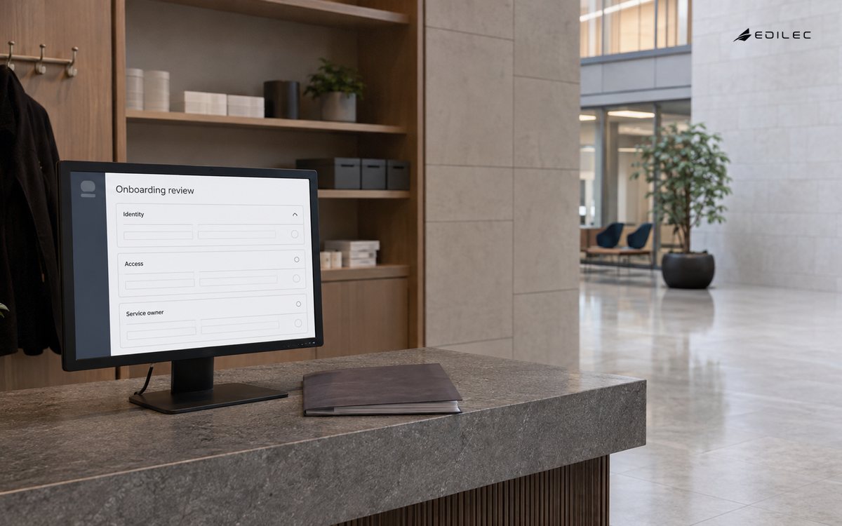 An onboarding review console sits with service materials in a people-operations reception.